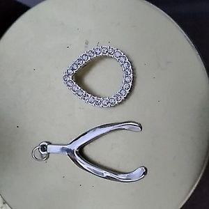 2 silver tone pendants